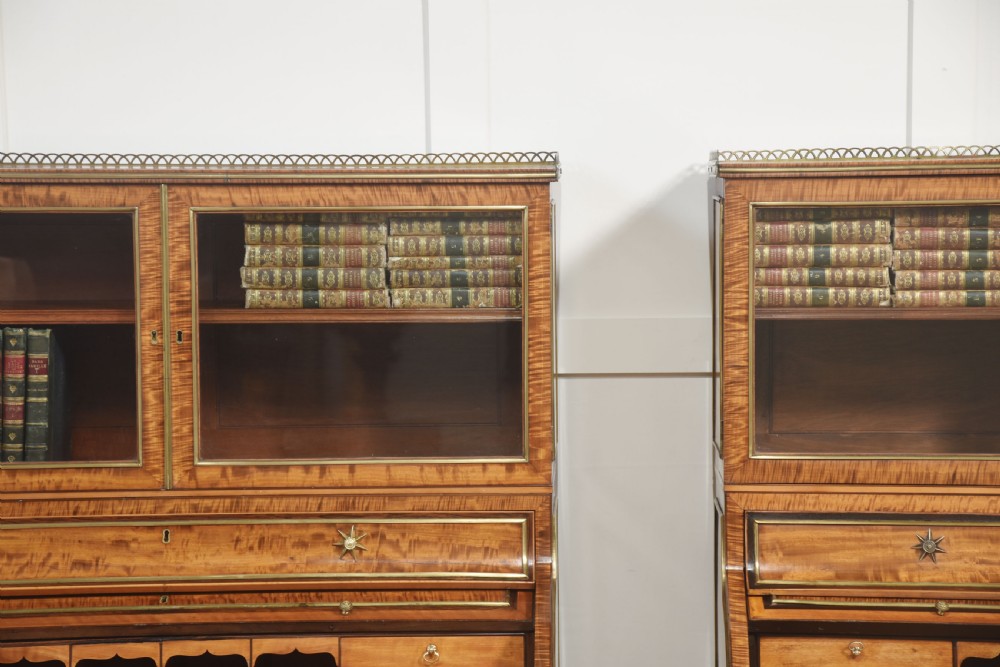 A pair of Georgian satinwood cylinder bureau cabinets with upper glazed doors, roll-top writing sections, and square tapered legs. View III