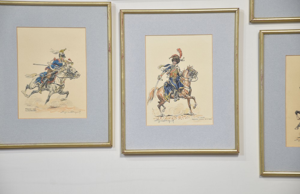 Set of five framed watercolour sketches depicting various military cavalry officers in detailed uniforms mounted on horseback. View VII