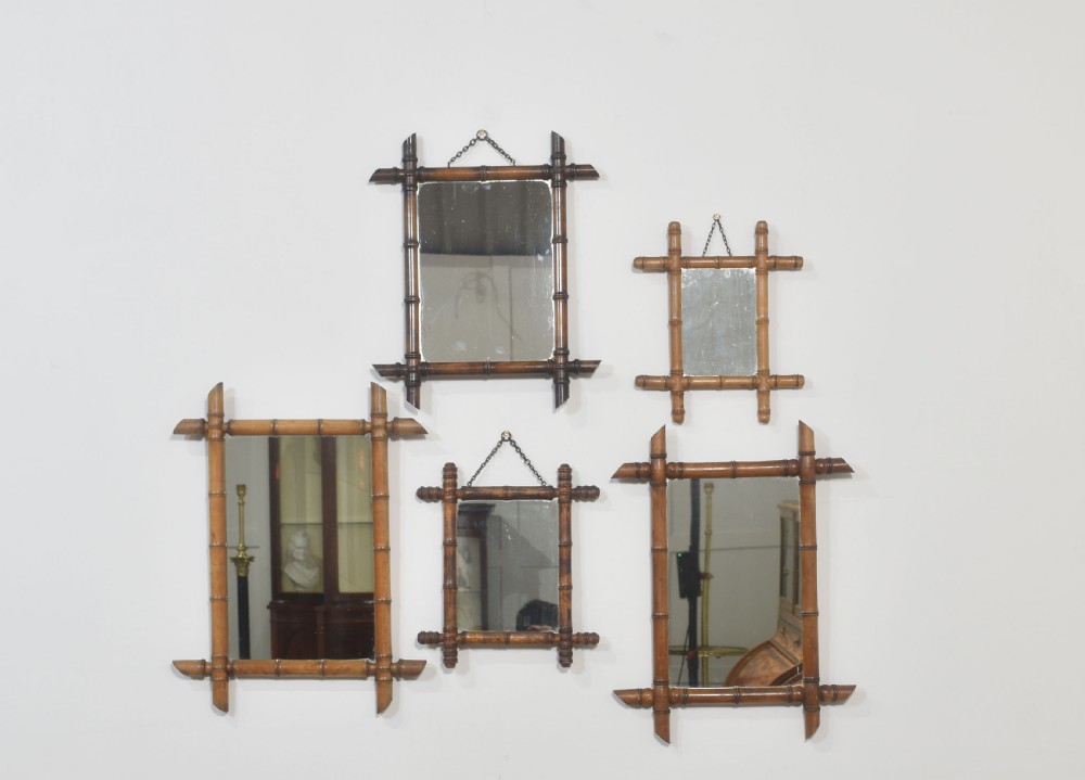 Five Bamboo framed mirrors