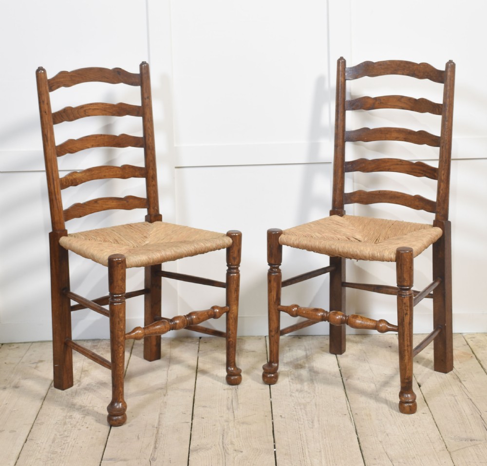 Set of six oak ladder back dining chairs View II
