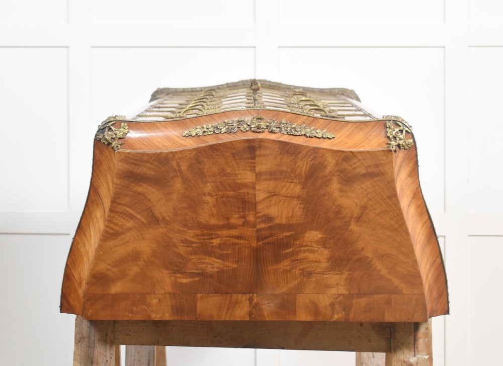 A tall, narrow French kingwood secretaire abattant featuring herringbone parquetry inlay, brass ormolu mounts, and seven drawer fronts with decorative handles. View XIII