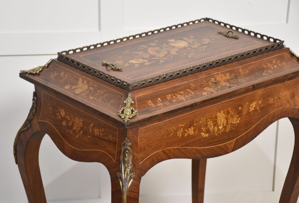 A 19th-century French style mahogany jardiniere table with floral marquetry inlay, cabriole legs, cast brass mounts, a pierced gallery rail, and a removable top panel. View V