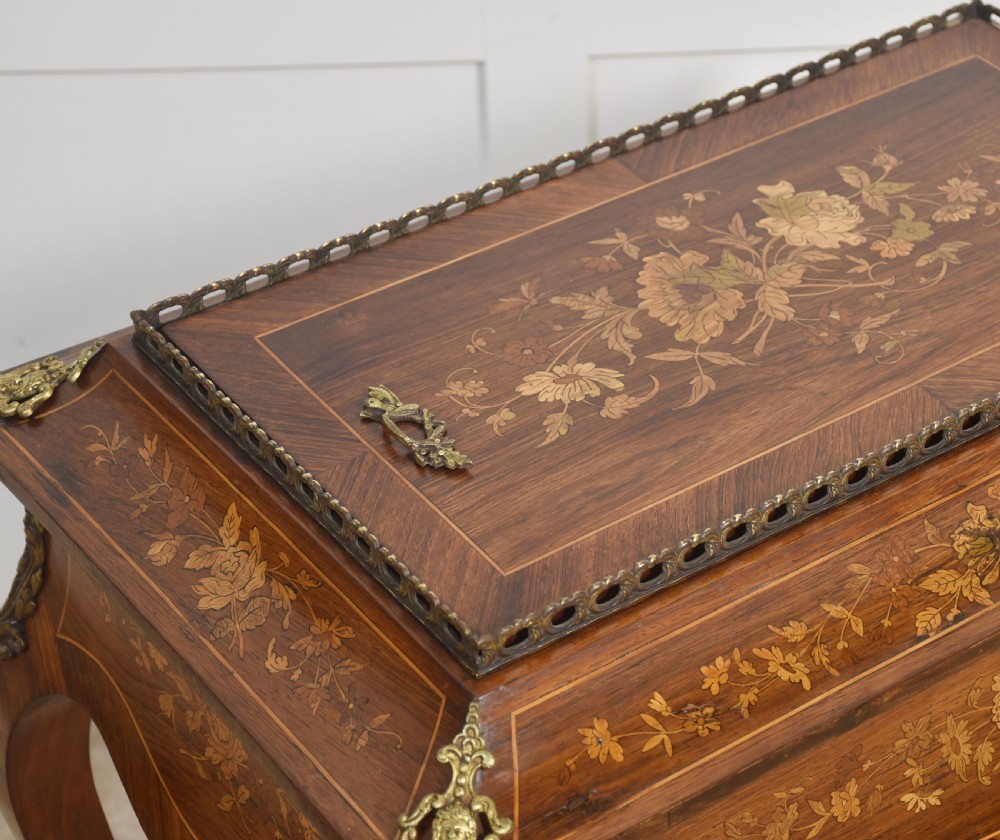 A 19th-century French style mahogany jardiniere table with floral marquetry inlay, cabriole legs, cast brass mounts, a pierced gallery rail, and a removable top panel. View VI