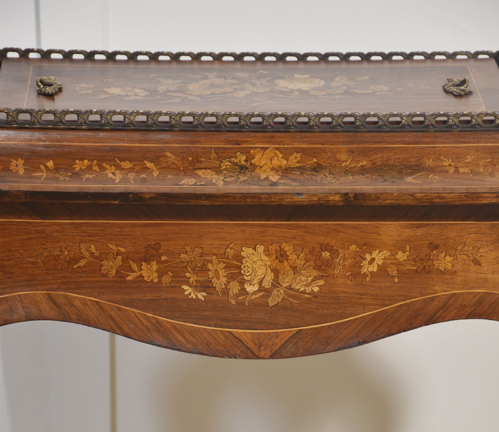A 19th-century French style mahogany jardiniere table with floral marquetry inlay, cabriole legs, cast brass mounts, a pierced gallery rail, and a removable top panel. View X