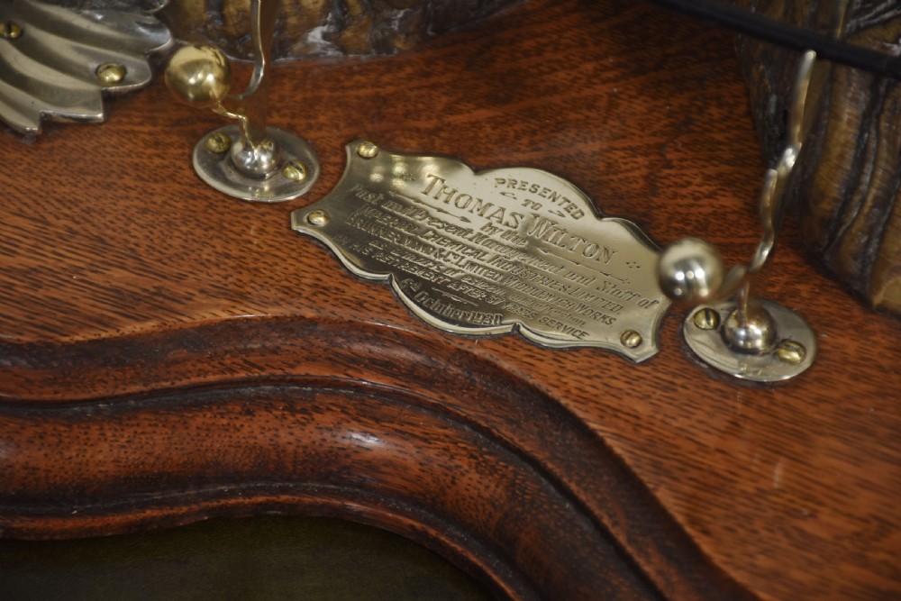 A 19th-century desk inkstand constructed from two curved natural horns, fitted with silvered dolphin-head mounts, inkwells, and a central suspended brass bell on a polished wooden base. View IX