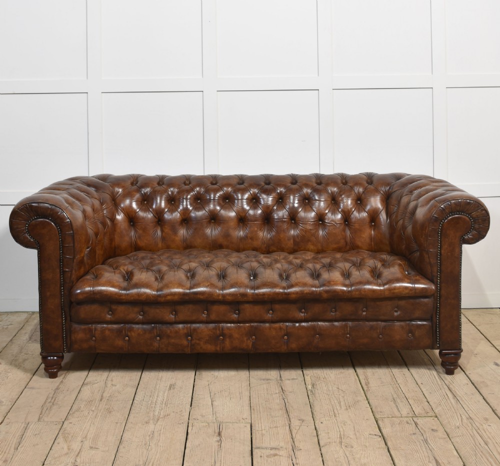 Brown leather deep buttoned chesterfield