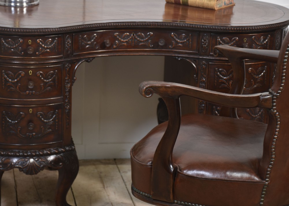 Carved mahogany kidney shaped desk View II