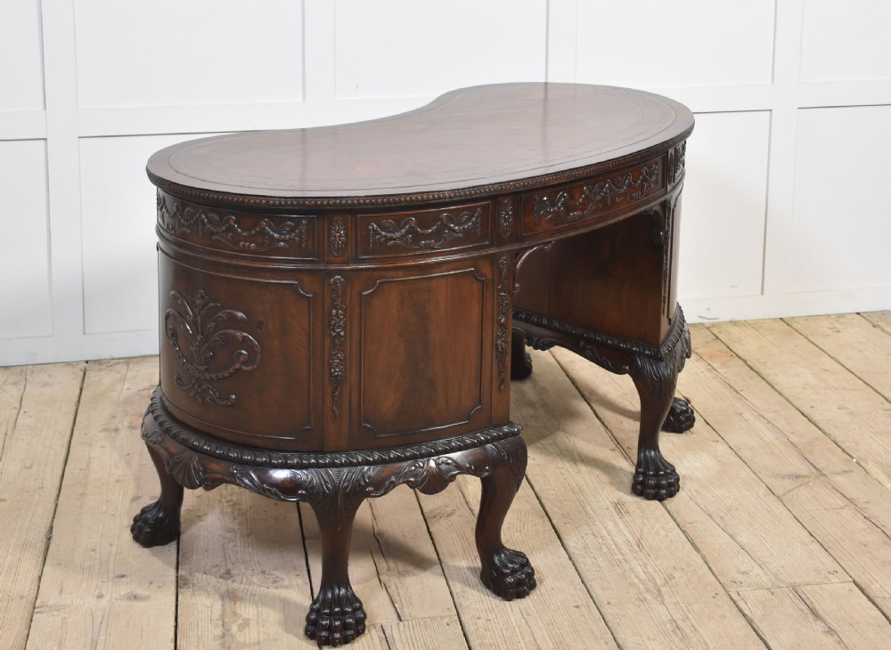 Carved mahogany kidney shaped desk View XVII