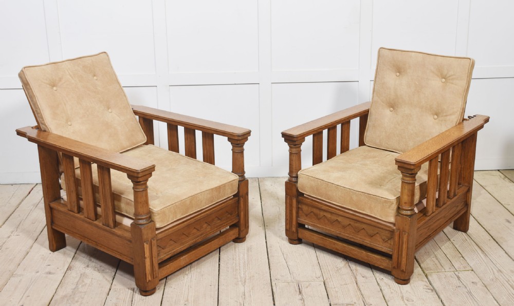 Pair of oak reclining armchairs
