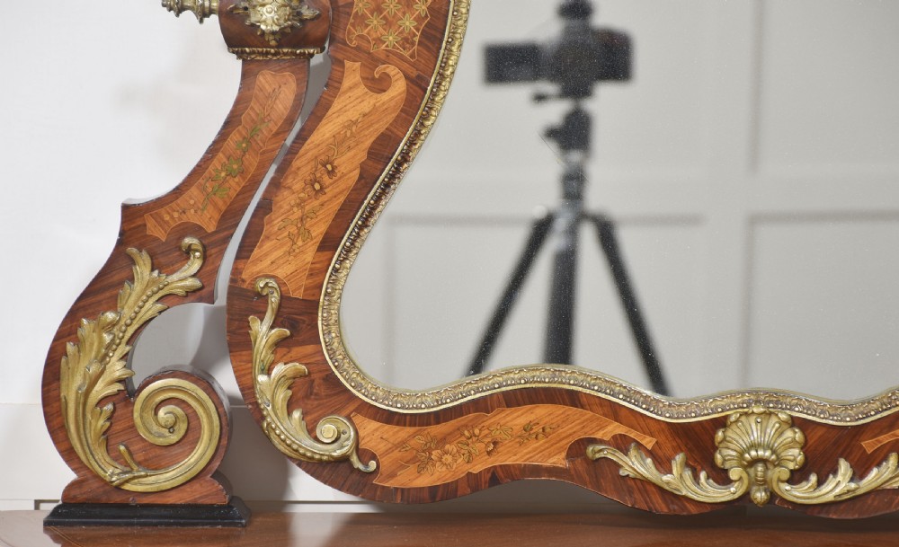 A Louis Philippe tulipwood dressing table featuring floral marquetry inlay, gilt bronze ormolu mounts, a shaped mirror with attached sconces, and cabriole legs. View III