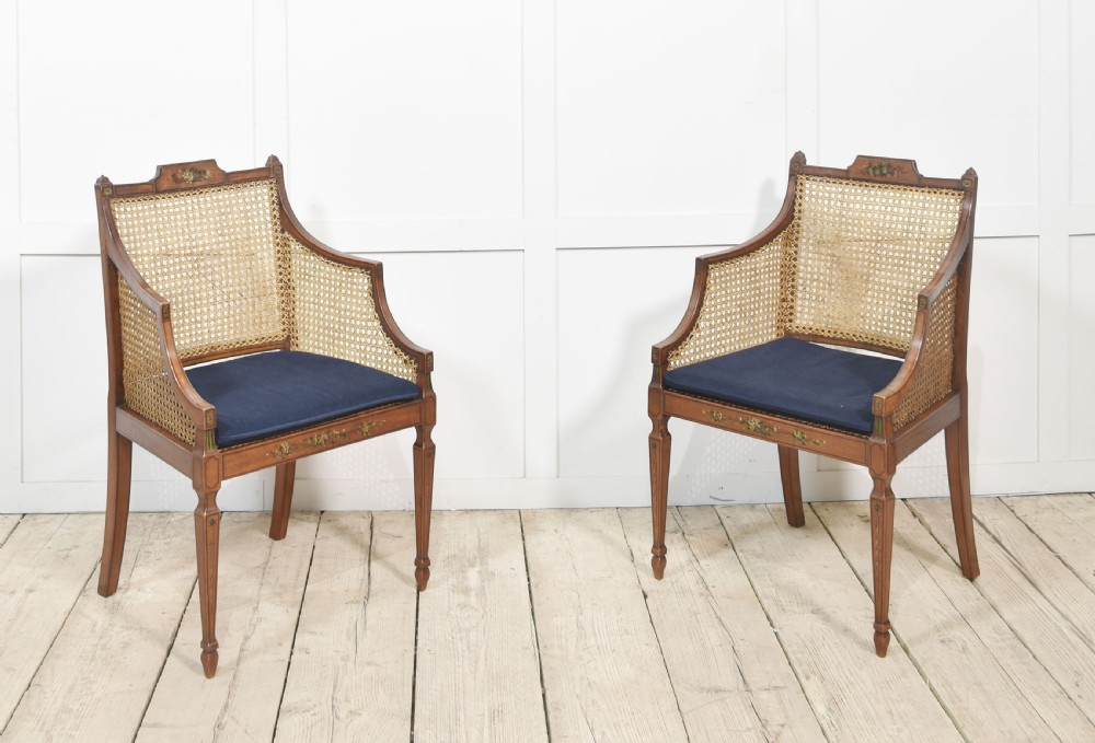 Pair of Sheraton revival satinwood and bergere armchairs