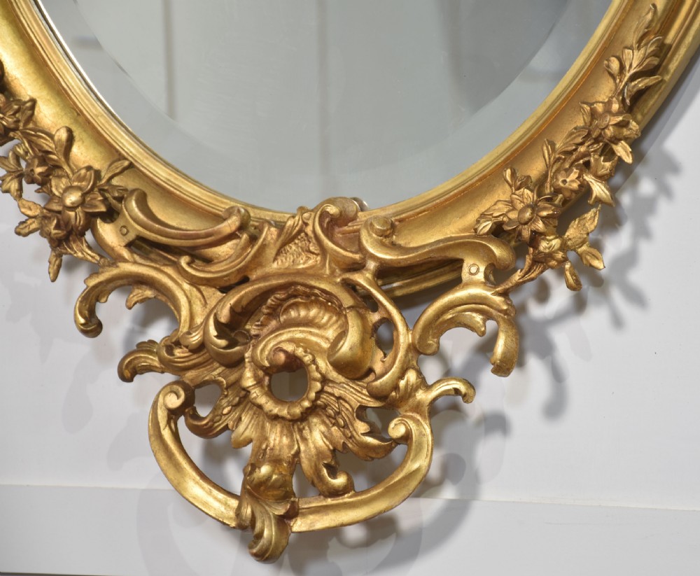 Carved gilt-wood oval wall mirror View VI