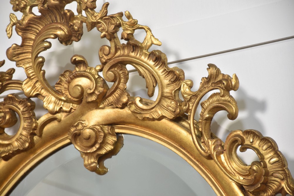 Carved gilt-wood oval wall mirror View VIII