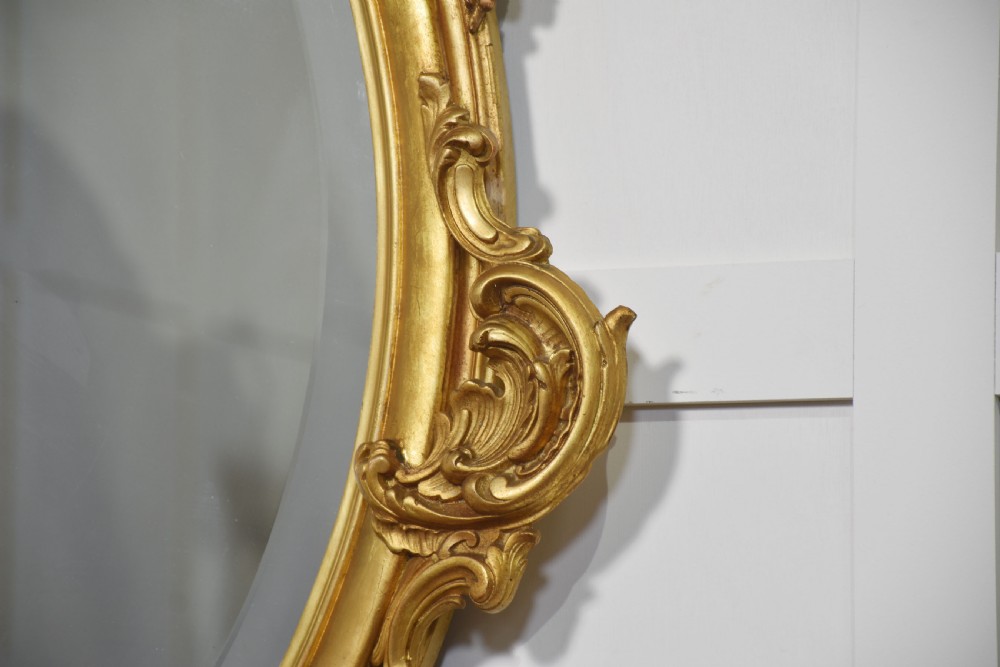Carved gilt-wood oval wall mirror View IX