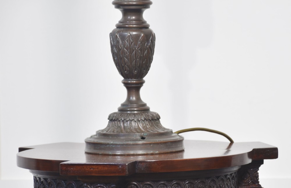 A pair of tall dark bronze newel post lamps featuring glazed hexagonal lanterns topped with decorative crown finials. View V