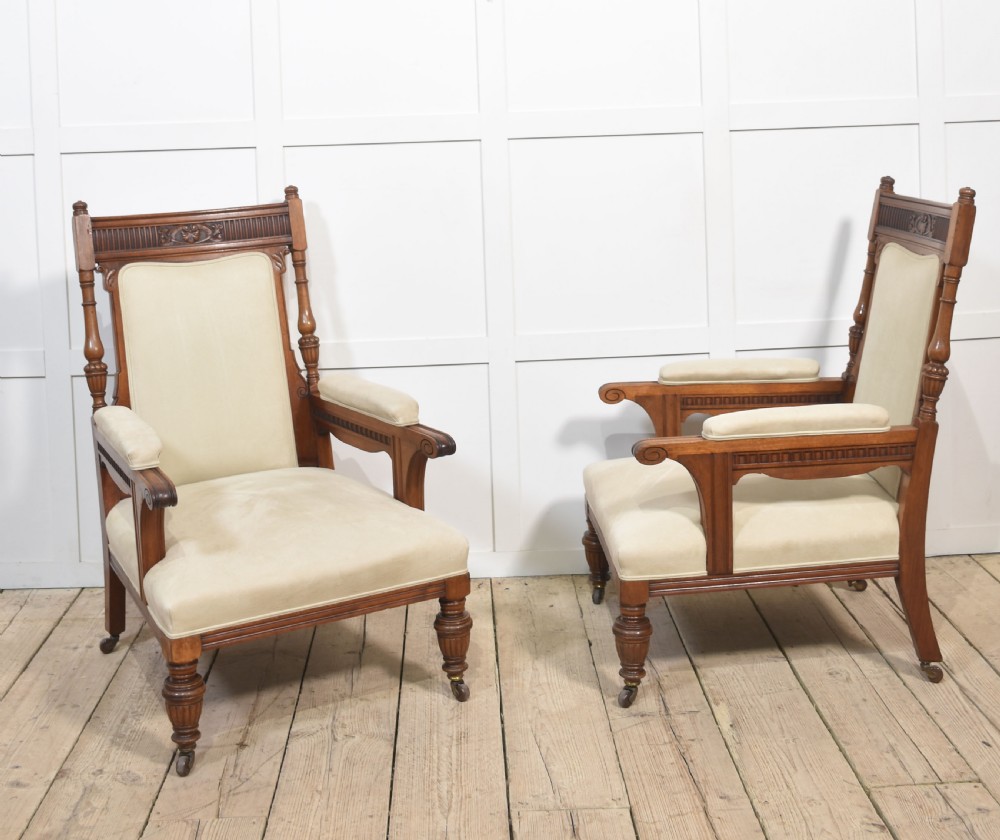 Pair of walnut upholstered library armchairs View II