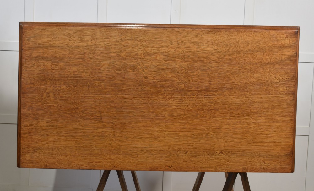 A carved oak two-door sideboard featuring two drawers with brass handles, central rosette carvings on the cupboard doors, and turned columns. View XIX