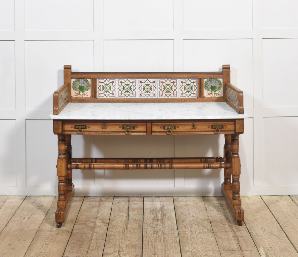 A pair of Aesthetic Movement bedroom tables comprising a marble-top tiled-back washstand and a matching dressing table with tilting mirror. View VI