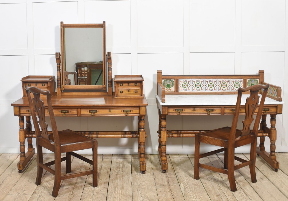 A pair of Aesthetic Movement bedroom tables comprising a marble-top tiled-back washstand and a matching dressing table with tilting mirror. View X