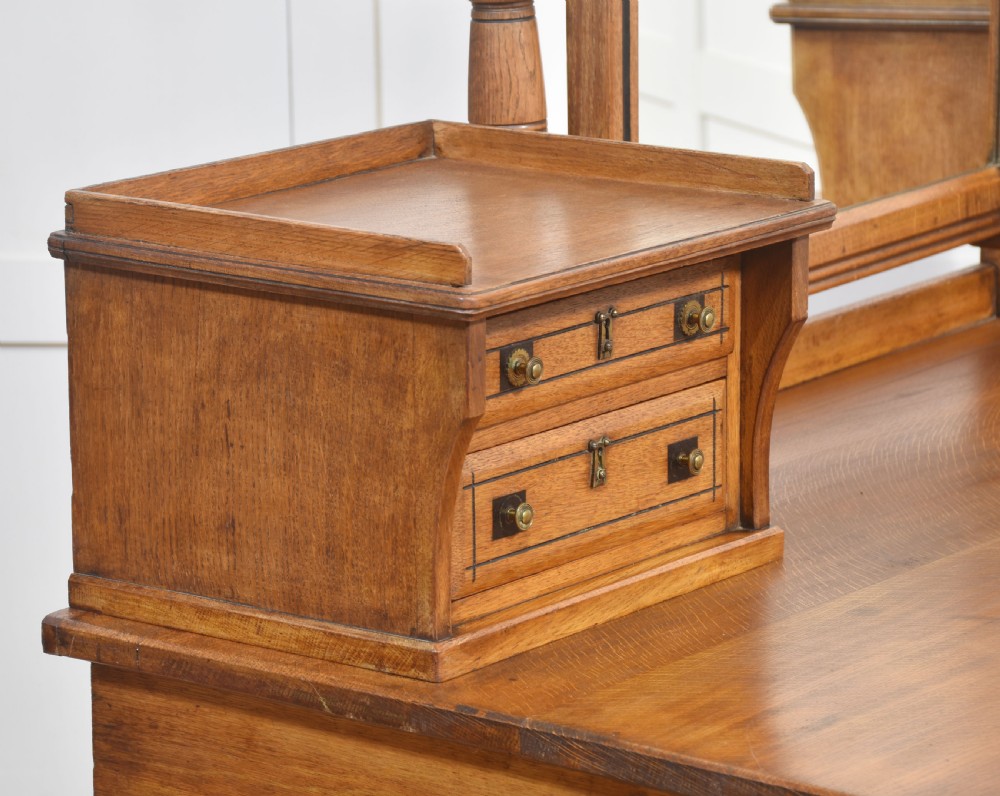 A pair of Aesthetic Movement bedroom tables comprising a marble-top tiled-back washstand and a matching dressing table with tilting mirror. View XII