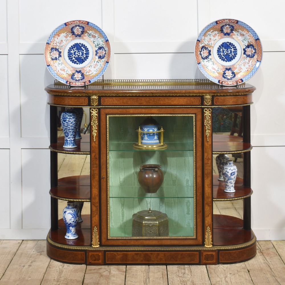 A pair of round Japanese Imari porcelain plates decorated with hand-painted cobalt blue, rust red, and gilded floral motifs. View XI
