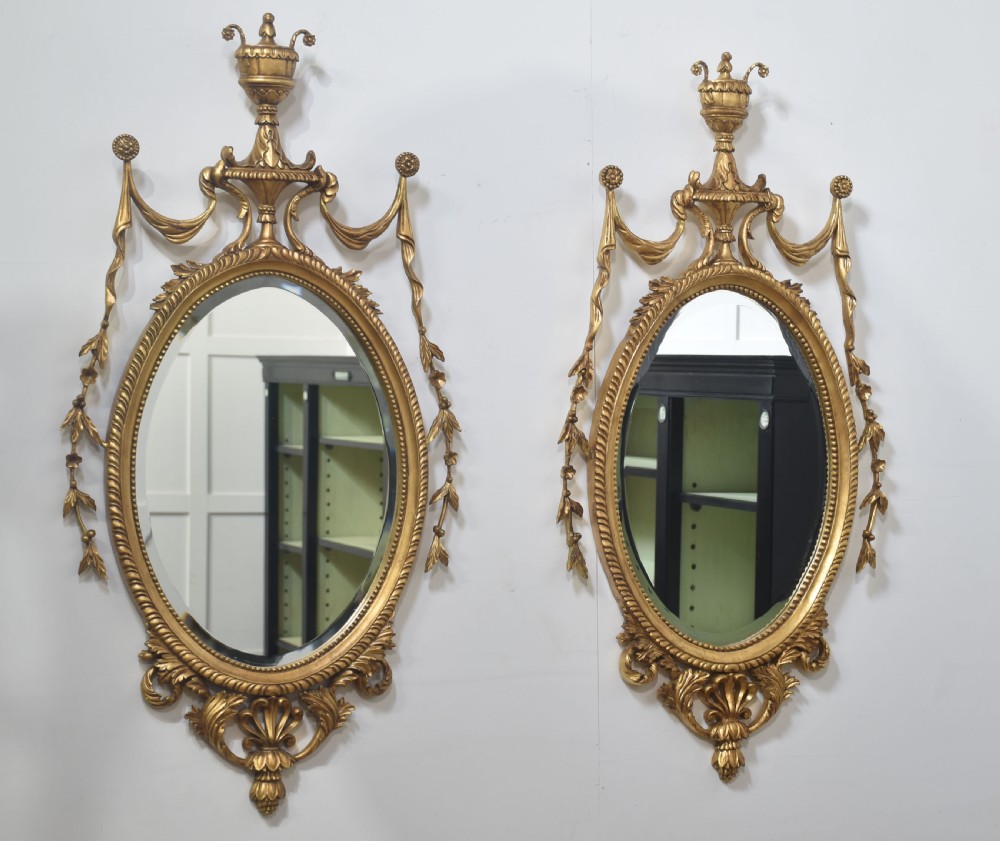  Pair of Adam style carved giltwood oval wall mirrors View X