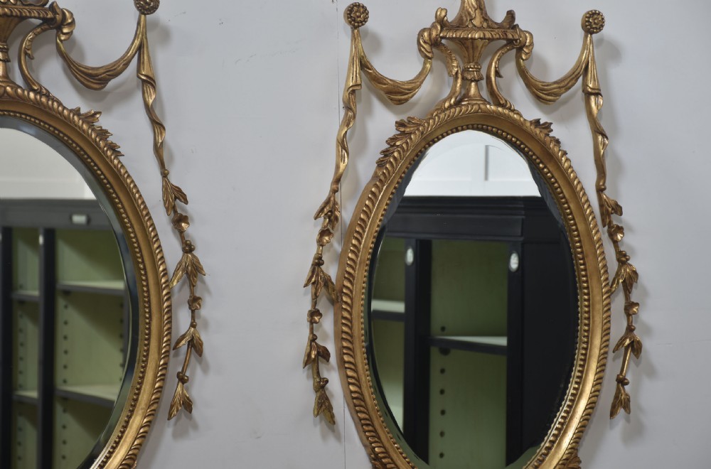  Pair of Adam style carved giltwood oval wall mirrors View XI