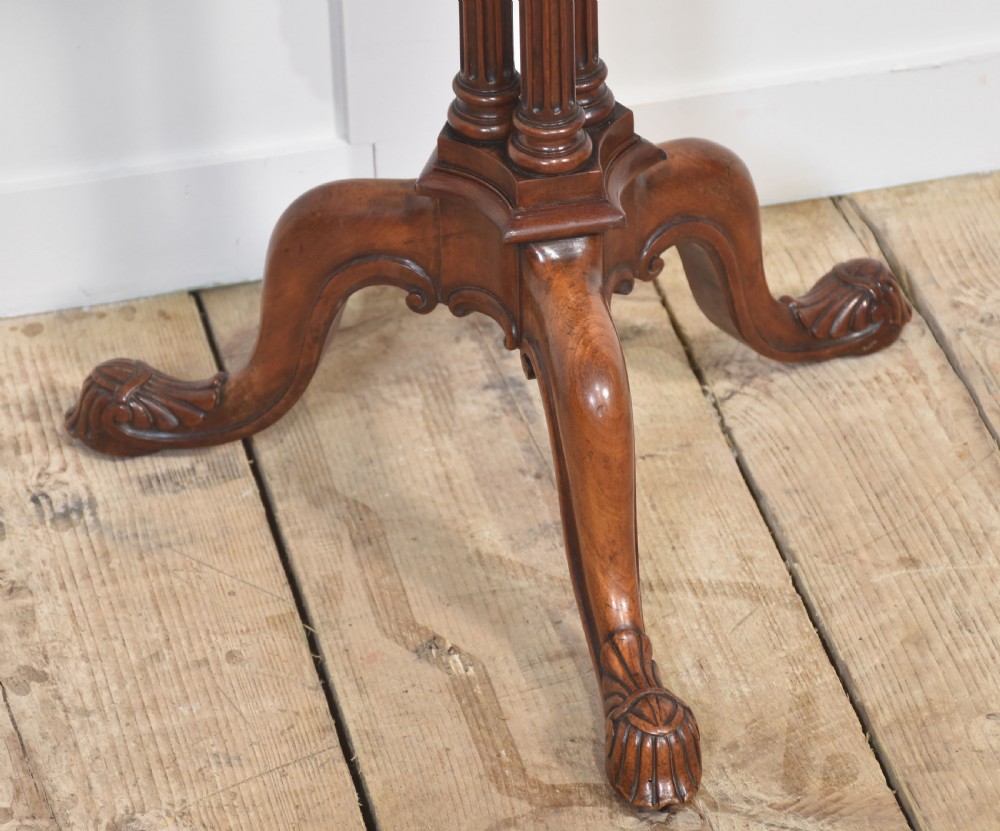 A George III satinwood tripod table with a piecrust rim resting on a fluted column and three carved cabriole legs. View III