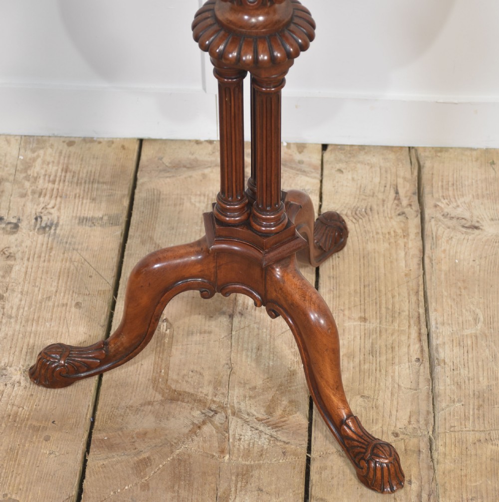 A George III satinwood tripod table with a piecrust rim resting on a fluted column and three carved cabriole legs. View IX