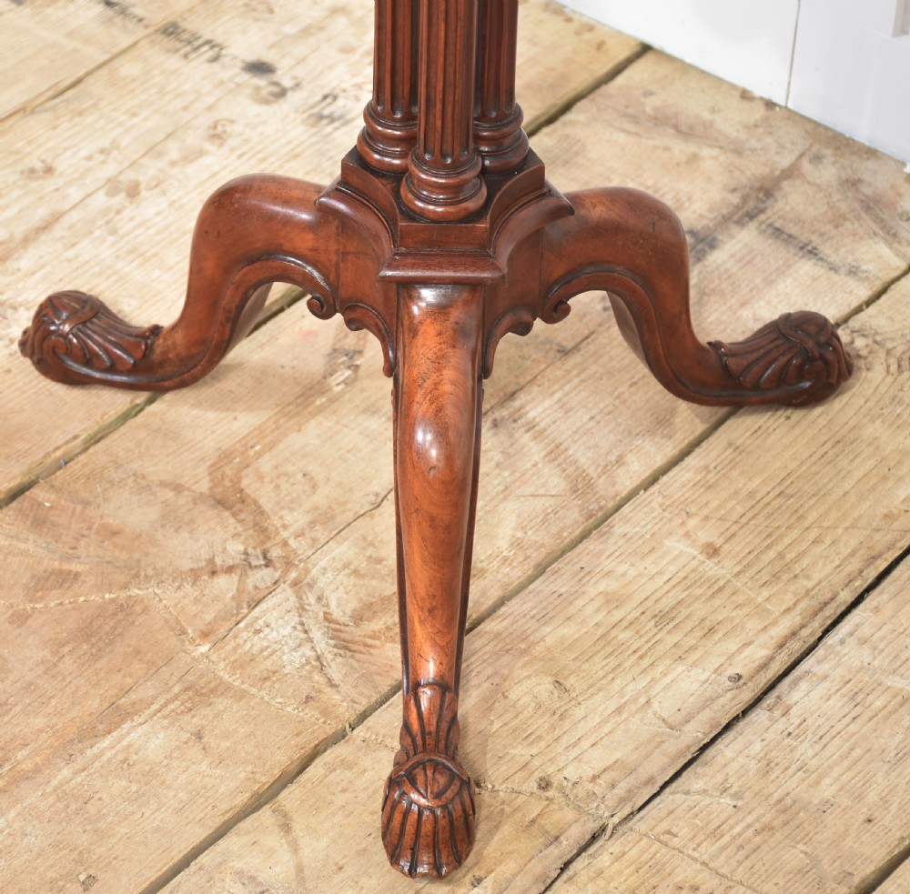 A George III satinwood tripod table with a piecrust rim resting on a fluted column and three carved cabriole legs. View XI