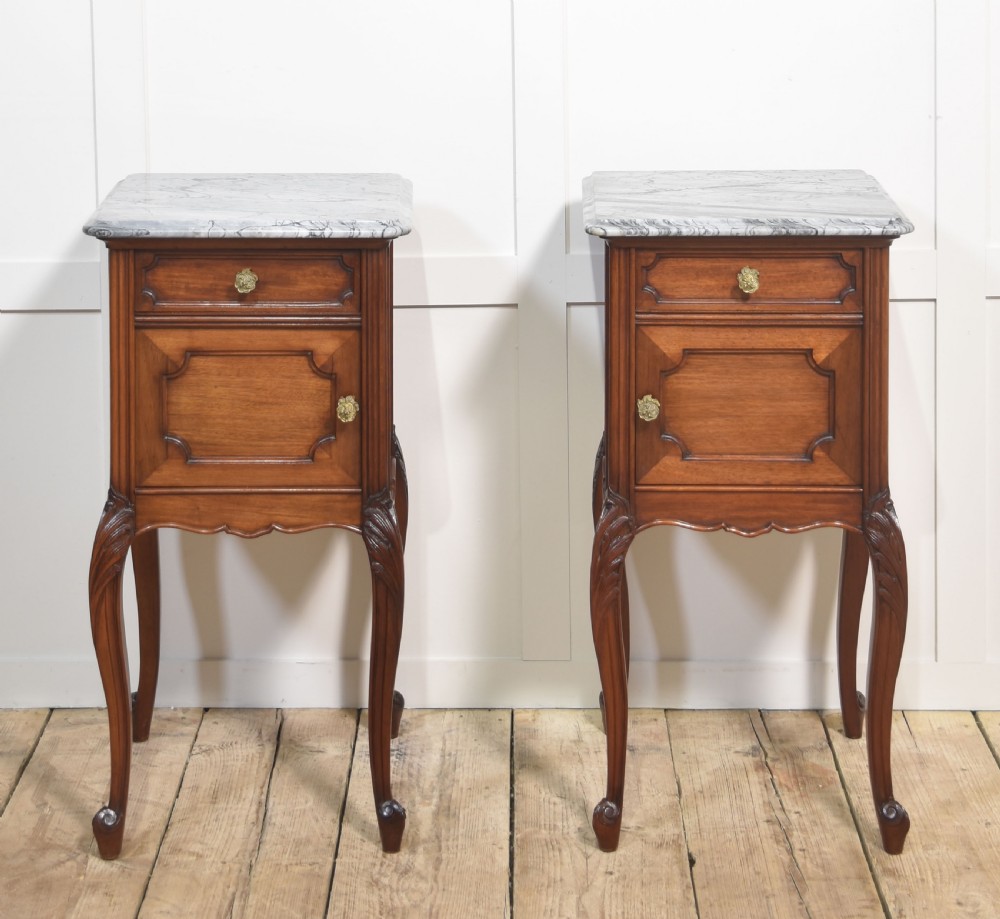 Pair of walnut marble top bedside cabinets