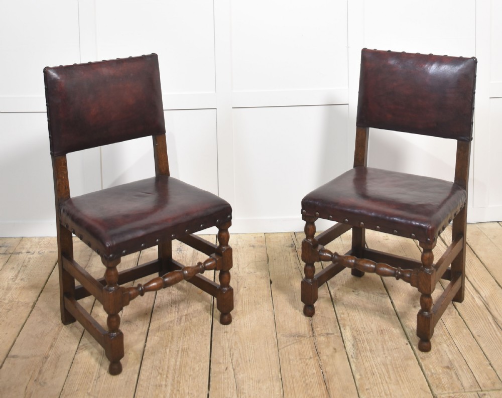 Eight leather upholstered oak dining chairs View III