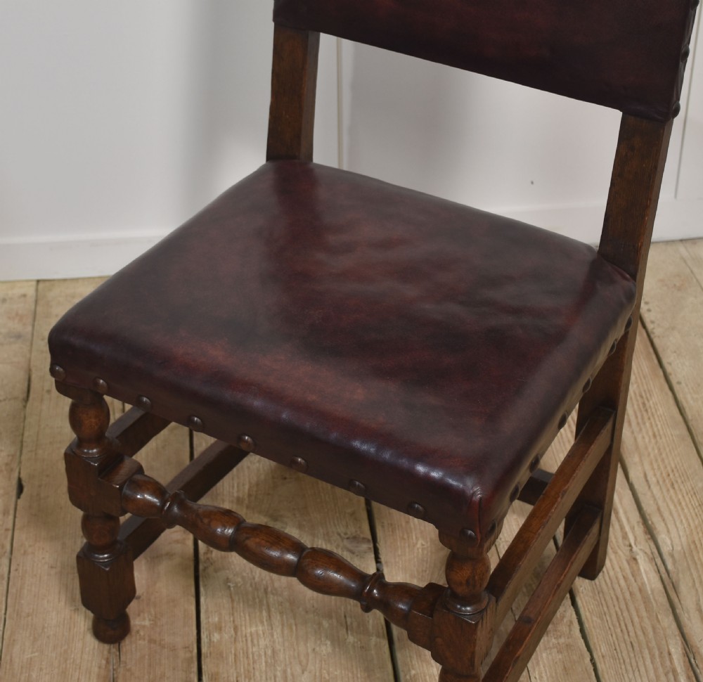 Eight leather upholstered oak dining chairs View VI