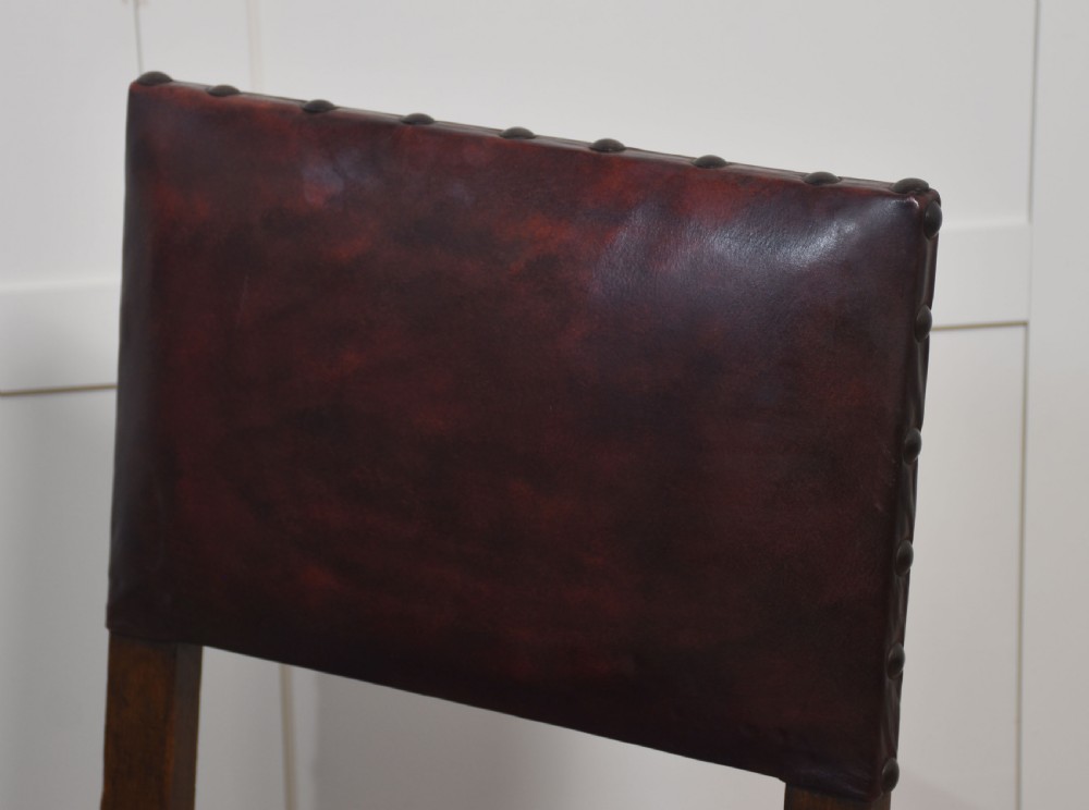 Eight leather upholstered oak dining chairs View VII