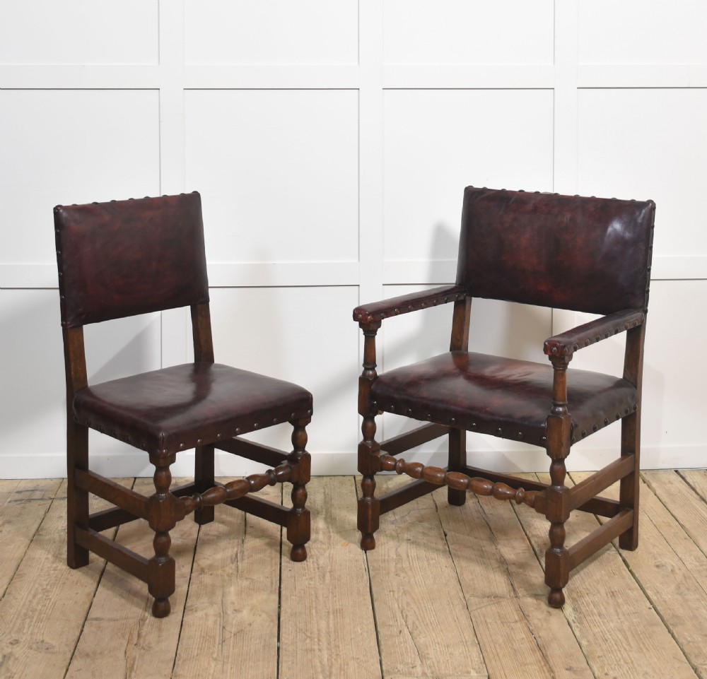 Eight leather upholstered oak dining chairs View IX