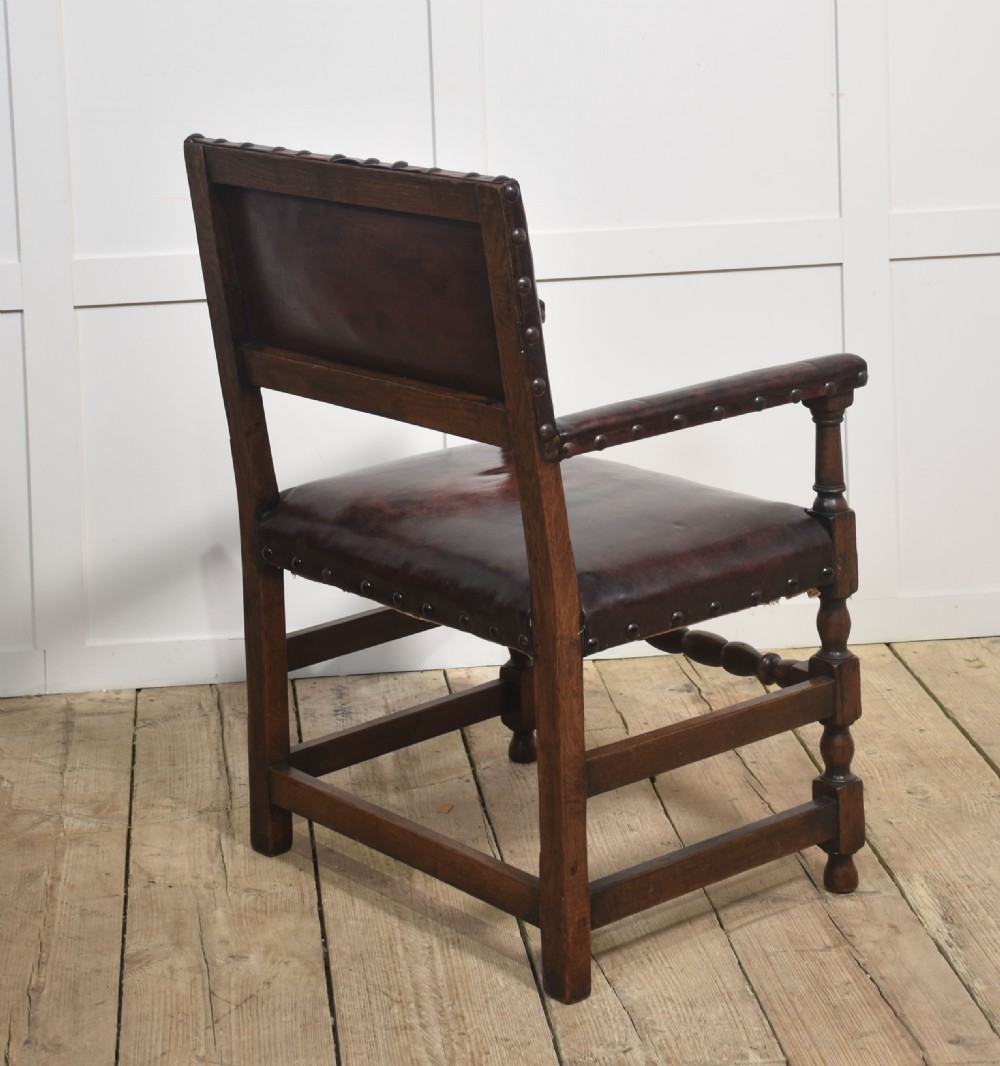 Eight leather upholstered oak dining chairs View XII