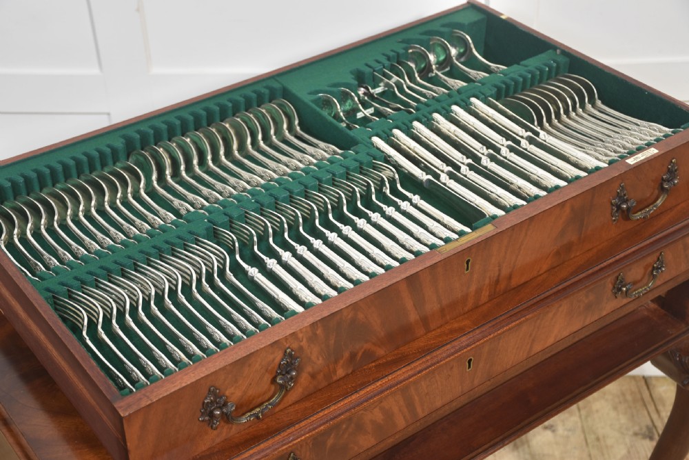 A polished mahogany cutlery chest table featuring two drawers with brass handles, raised on carved cabriole legs with ball and claw feet. View XII