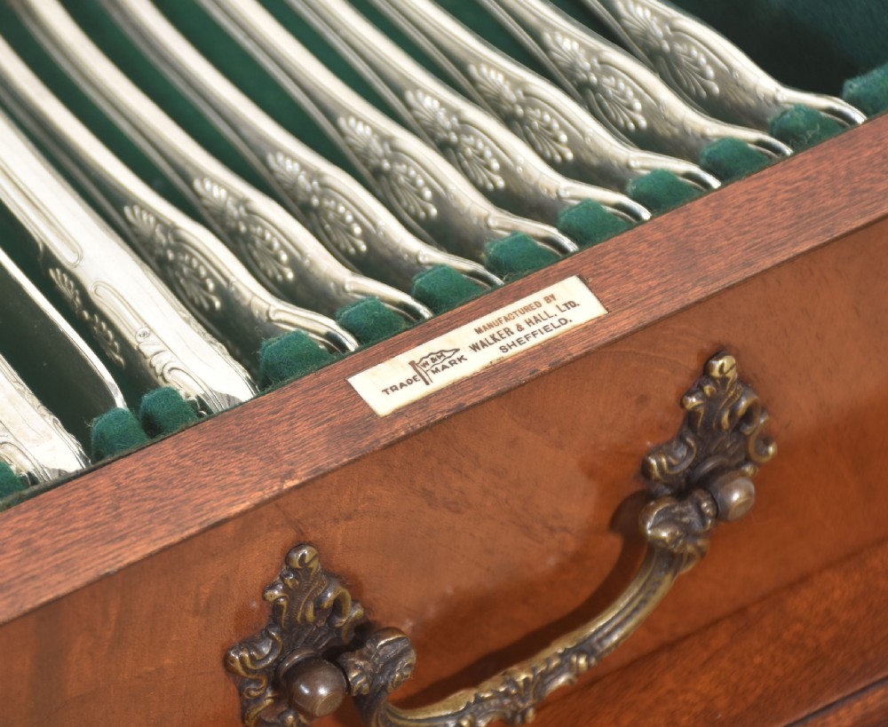 A polished mahogany cutlery chest table featuring two drawers with brass handles, raised on carved cabriole legs with ball and claw feet. View XIII