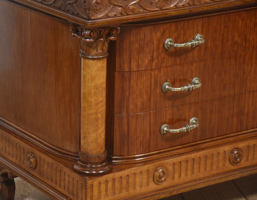 A 19th-century mahogany dressing chest featuring three flame mahogany drawers, carved sphinx supports framing a tall rectangular mirror, a marble top, and brass handles. View XIII