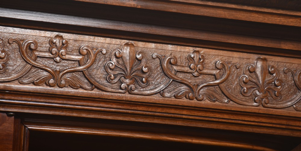 Large Victorian mahogany four-door wardrobe with central etched mirror doors, carved frieze, fluted side columns, and bracket feet. View X