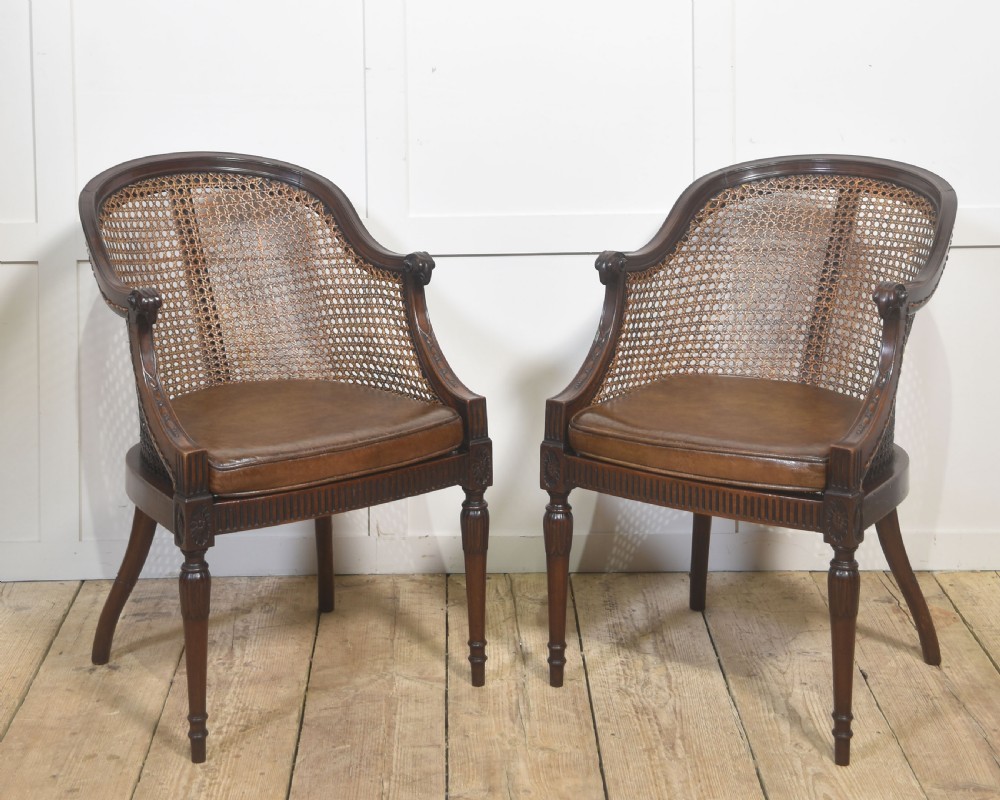 Pair Of Carved Mahogany And Cane Library Chairs