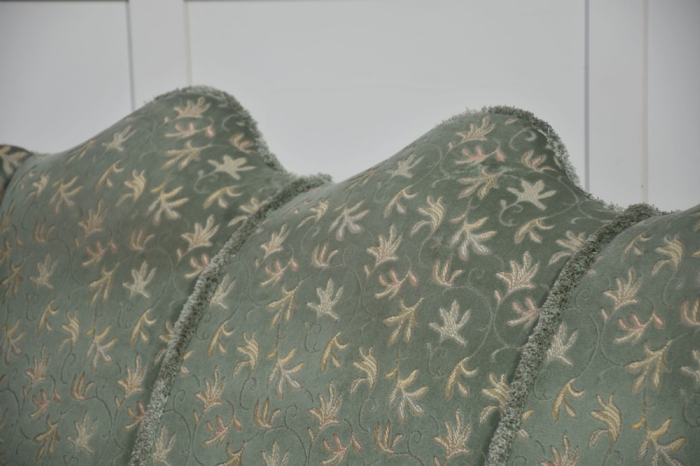 A Queen Anne style three-seat wingback sofa upholstered in patterned green fabric with carved cabriole legs and ball-and-claw feet. View X