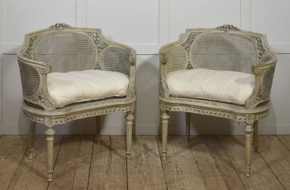 Elegant Pair of French Carved & Caned Tub Chairs In The Louis XVI Style