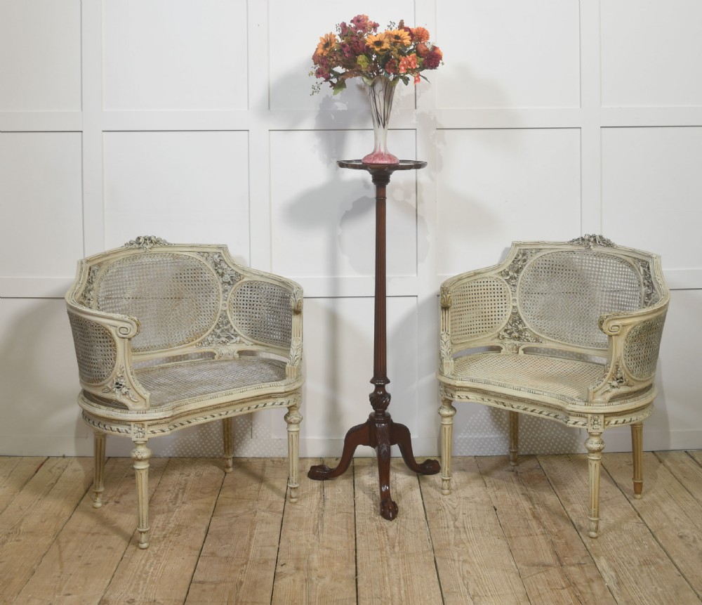 A tall mahogany tripod wine table featuring a scalloped piecrust rim, reeded column, and carved legs with ball and claw feet. View III