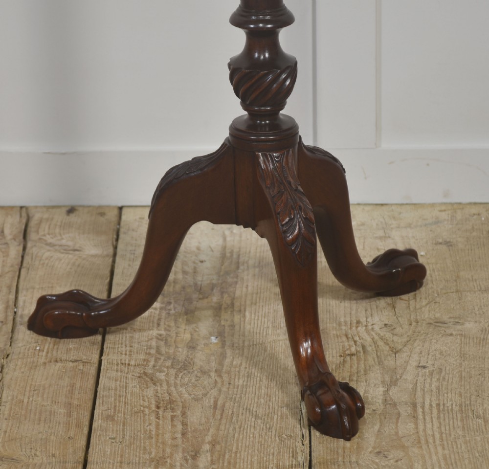 A tall mahogany tripod wine table featuring a scalloped piecrust rim, reeded column, and carved legs with ball and claw feet. View V