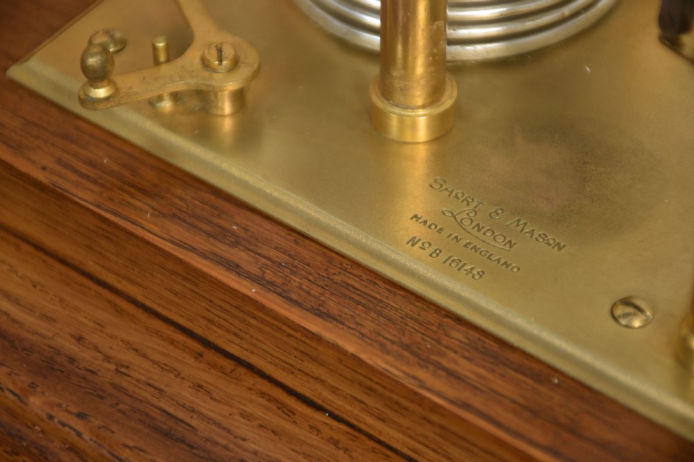 An antique barograph with a brass mechanism and paper chart drum enclosed within a glazed oak case with a bottom drawer. View VIII