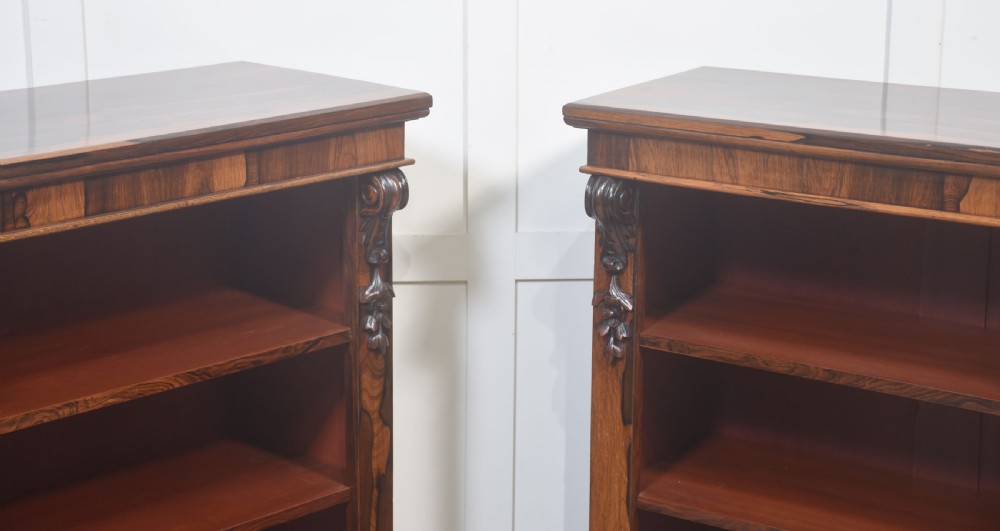 A pair of 19th-century rosewood open bookcases featuring carved side corbels and three open shelves each on a solid plinth base. View XIII