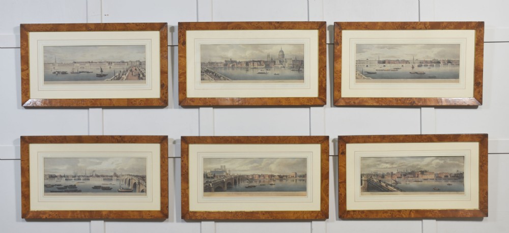 A set of six matching framed rectangular prints displaying panoramic views of the River Thames set within rich burr walnut frames with light cream mounts.