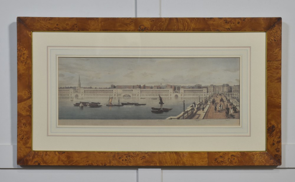 A set of six matching framed rectangular prints displaying panoramic views of the River Thames set within rich burr walnut frames with light cream mounts. View VI