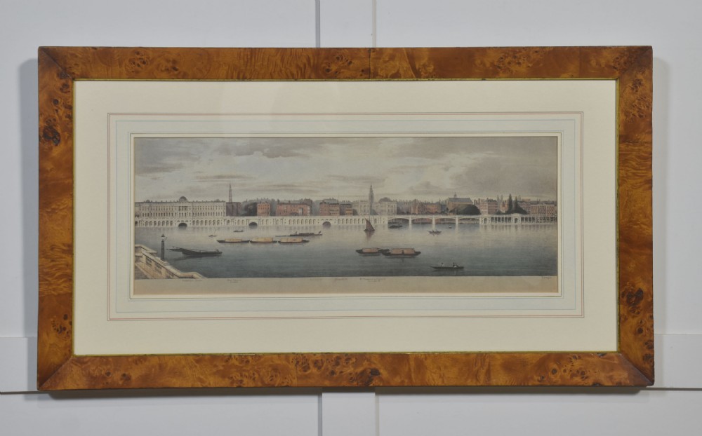 A set of six matching framed rectangular prints displaying panoramic views of the River Thames set within rich burr walnut frames with light cream mounts. View XIII